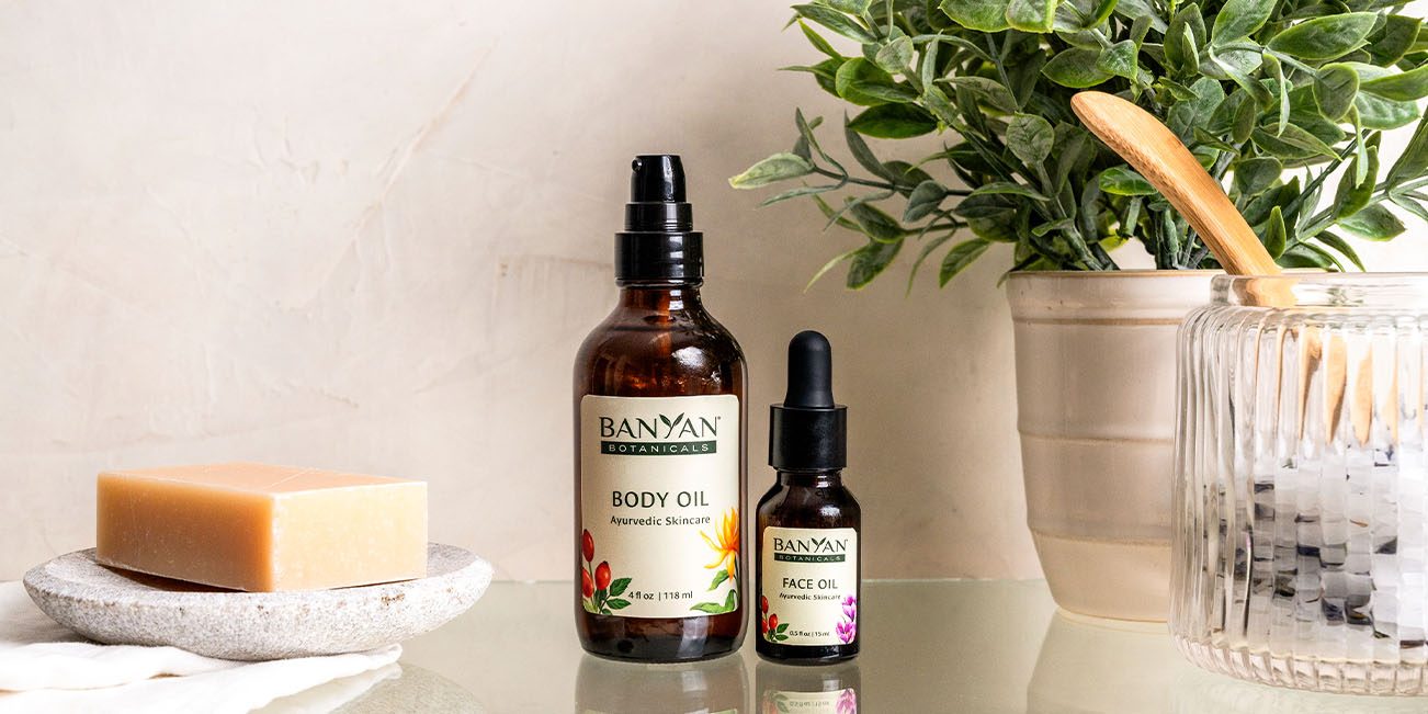 banyan botanicals face and body oil in bathroom setting