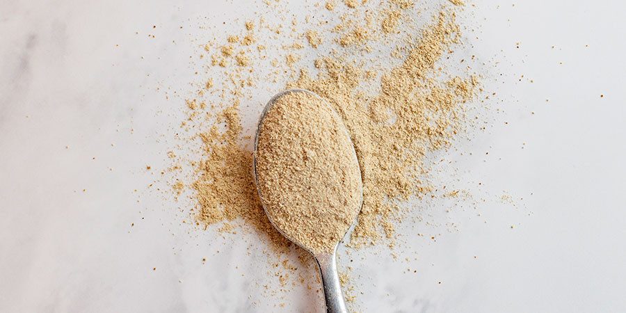 Ashwagandha Latte Mix powder on spoon