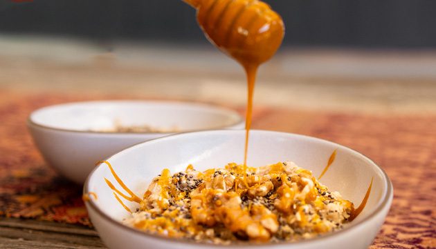 honey dripping on oatmeal